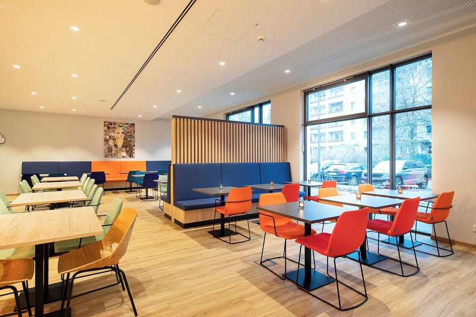 Gather for easy meals in the colorful, modern dining space.