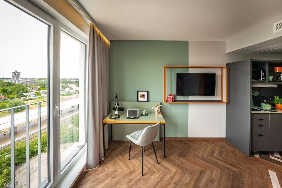Sip morning coffee by the window with a flexible workspace