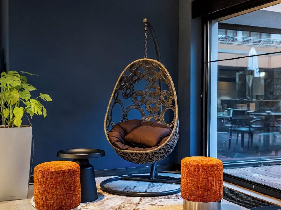 Unwind in a cozy lounge nook beside large windows