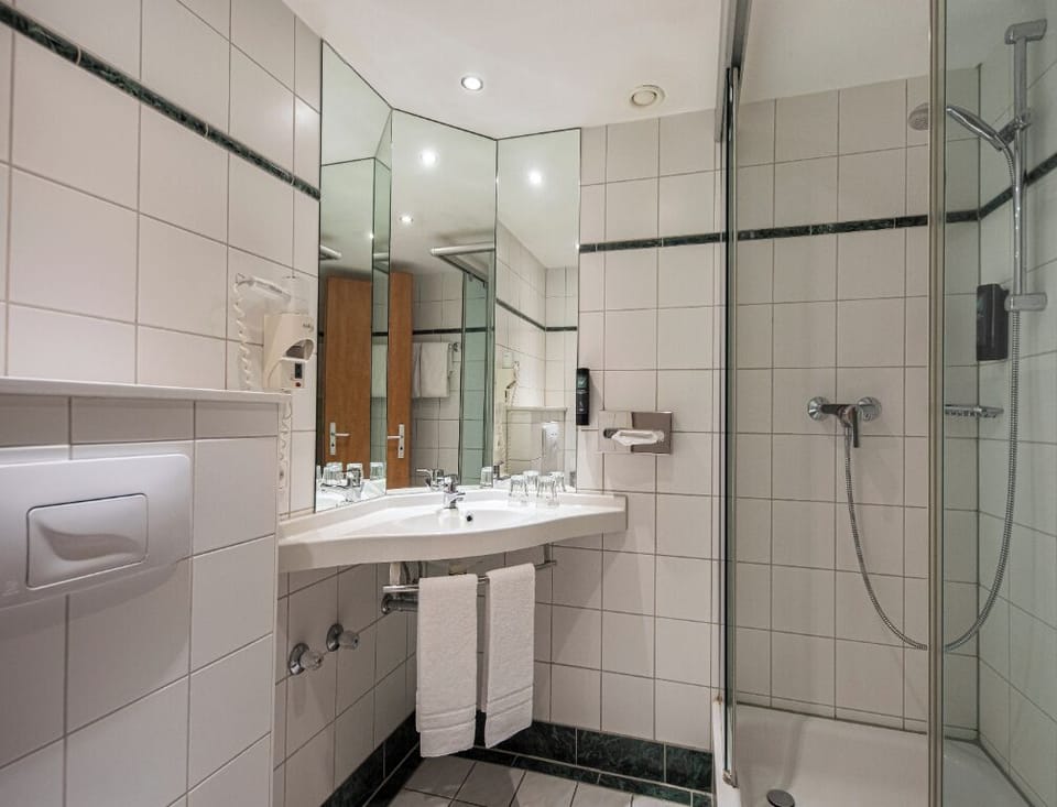 Refresh under a sleek glass shower after a long day.