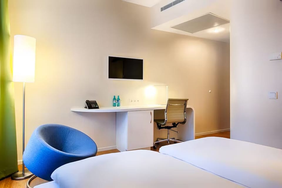Recharge comfortably, then catch up on emails at the desk.