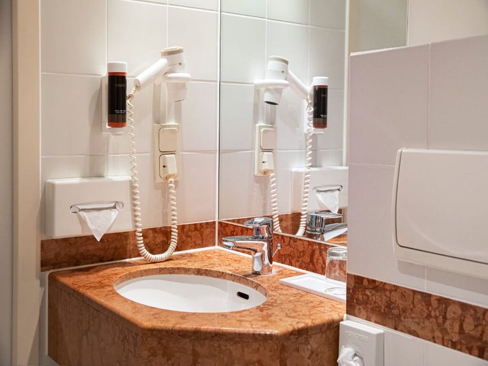 Get ready with a well-lit vanity and generous counter space.