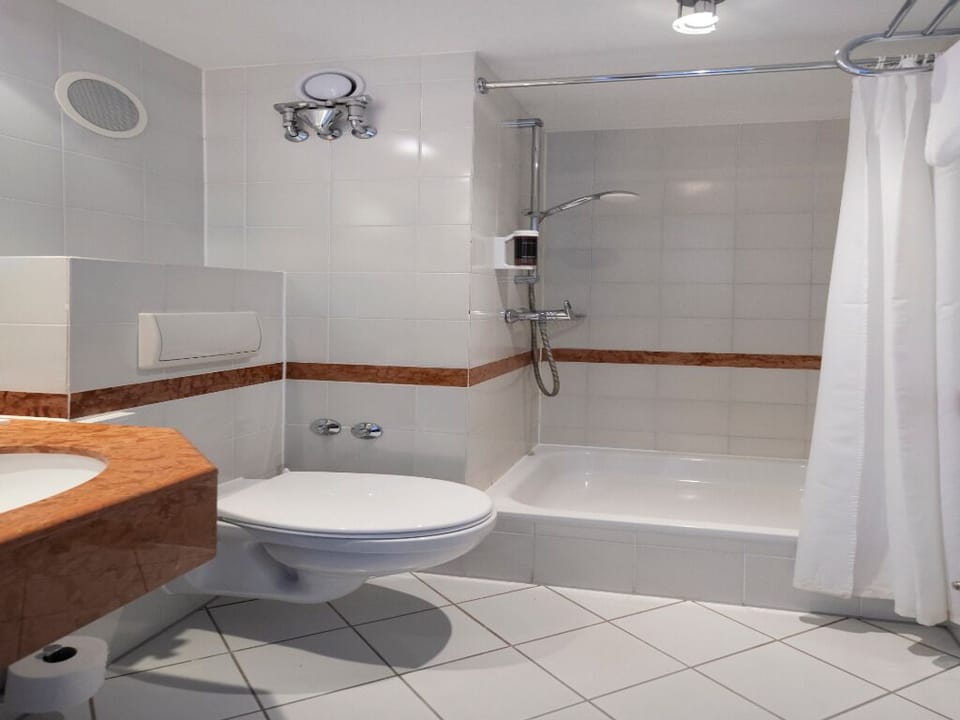 Enjoy a spacious, spotless bathroom with plenty of room.
