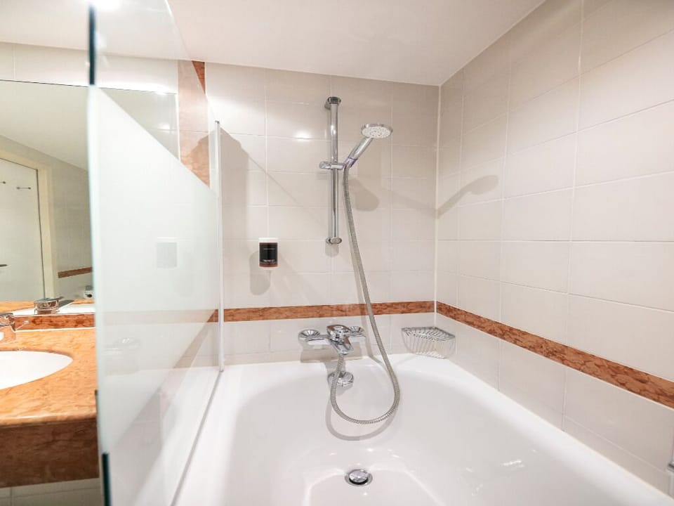 Rinse off under the adjustable shower for a spa-like reset.