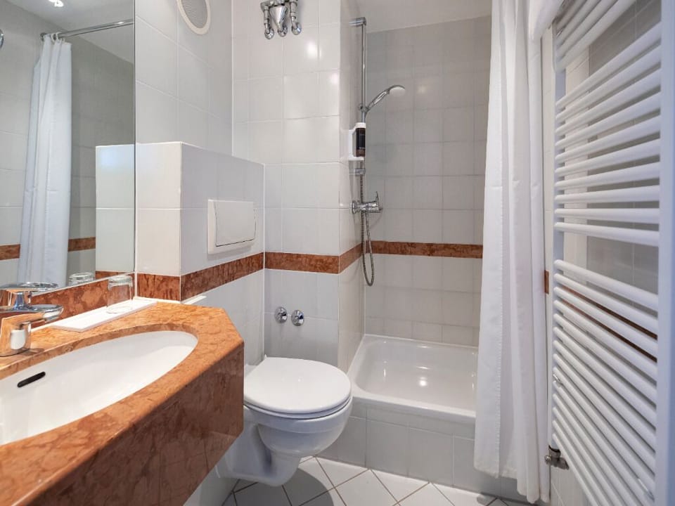Refresh easily in a clean bath with tub-shower combo.