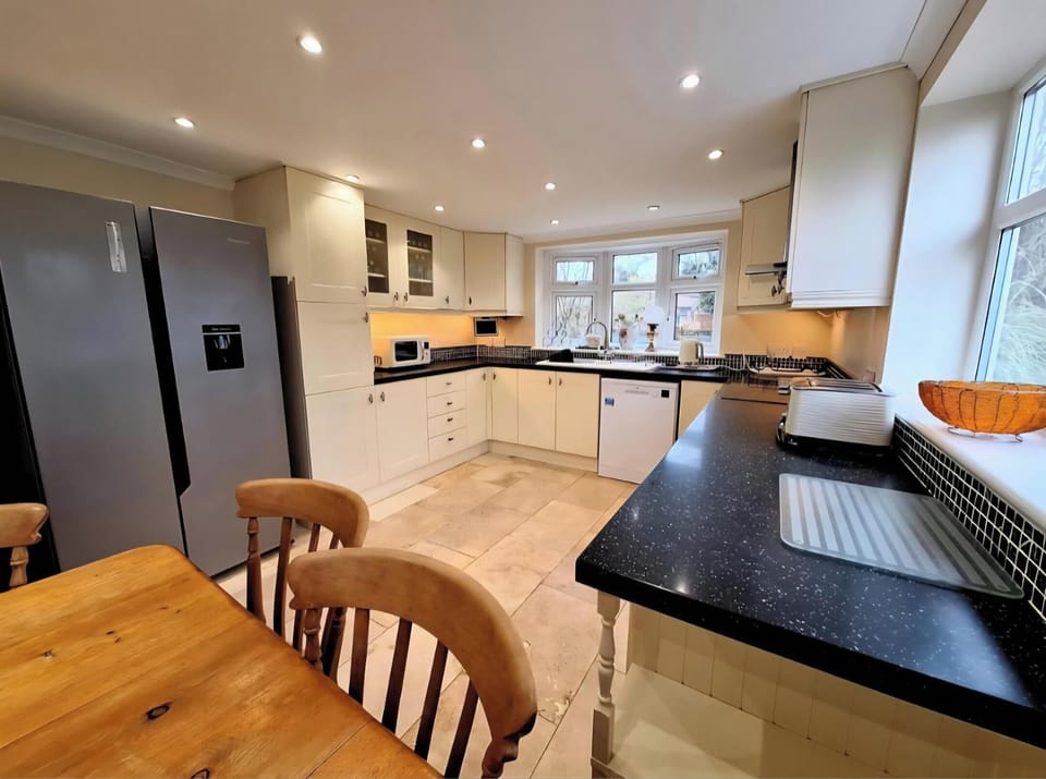 Dining table view into kitchen area.