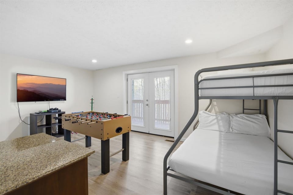 Fun-filled bunk room with foosball table for endless entertainment