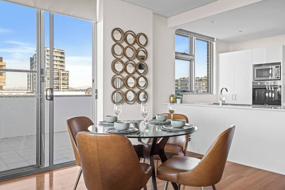 Gather around the dining table for family meals, perfectly positioned beside the kitchen for easy transitions.