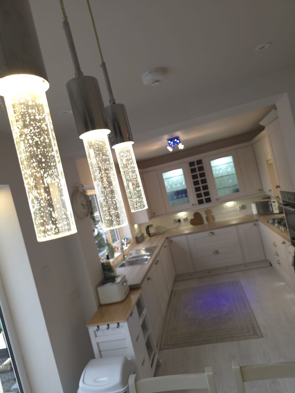 champagne lighting over dining area .