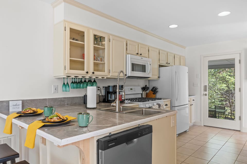 Full Kitchen: Bright and inviting, perfect for culinary adventures with nature views just outside!