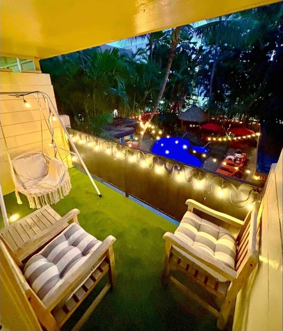 Your our own private swing on the balcony overlooking the pool oasis garden