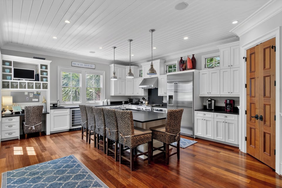 Your spacious kitchen invites culinary adventures with gleaming appliances, ample counter space, and a cozy island for morning coffee or evening conversations.