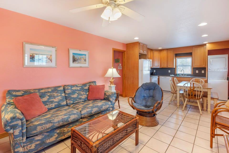 Living room and kitchen areas, featuring a washer & dryer in unit