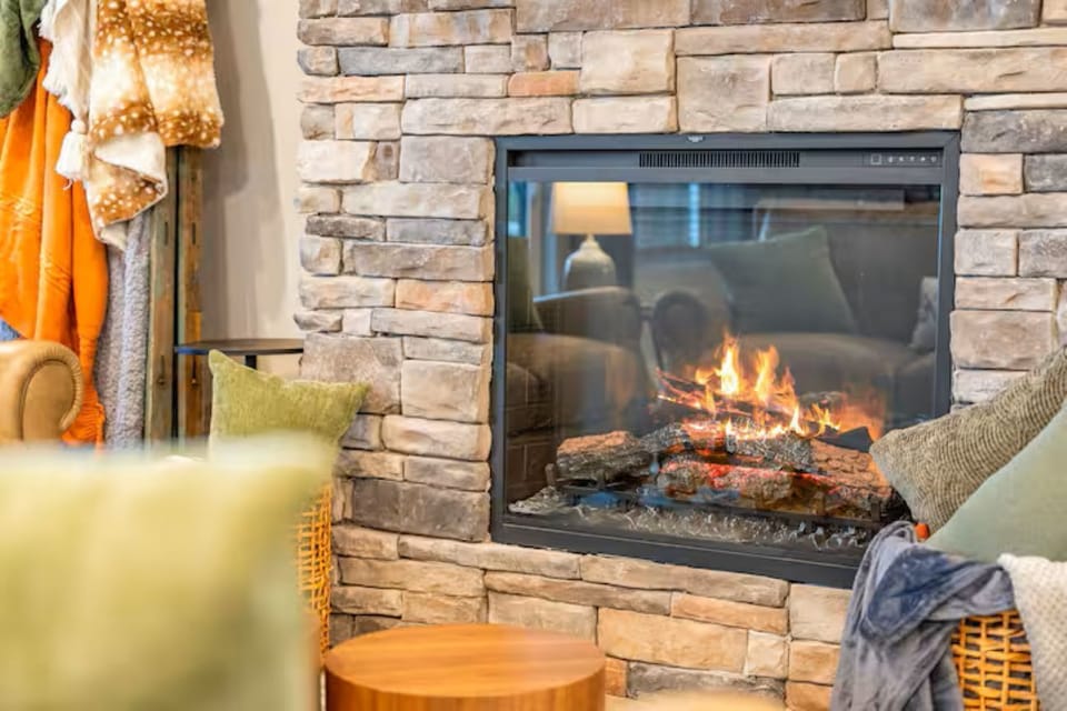 Cozy up by the stone fireplace-it's electric with multiple settings.