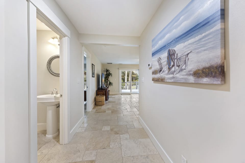 Entry way with view of half bathroom