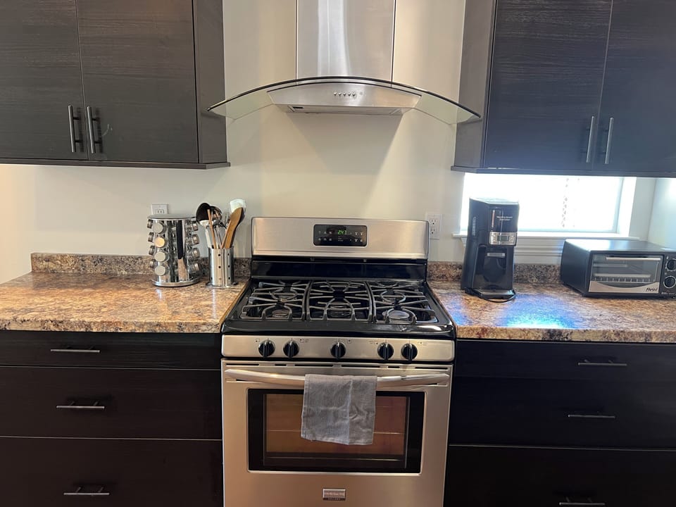 Upscale appliances, coffee maker, toaster oven.