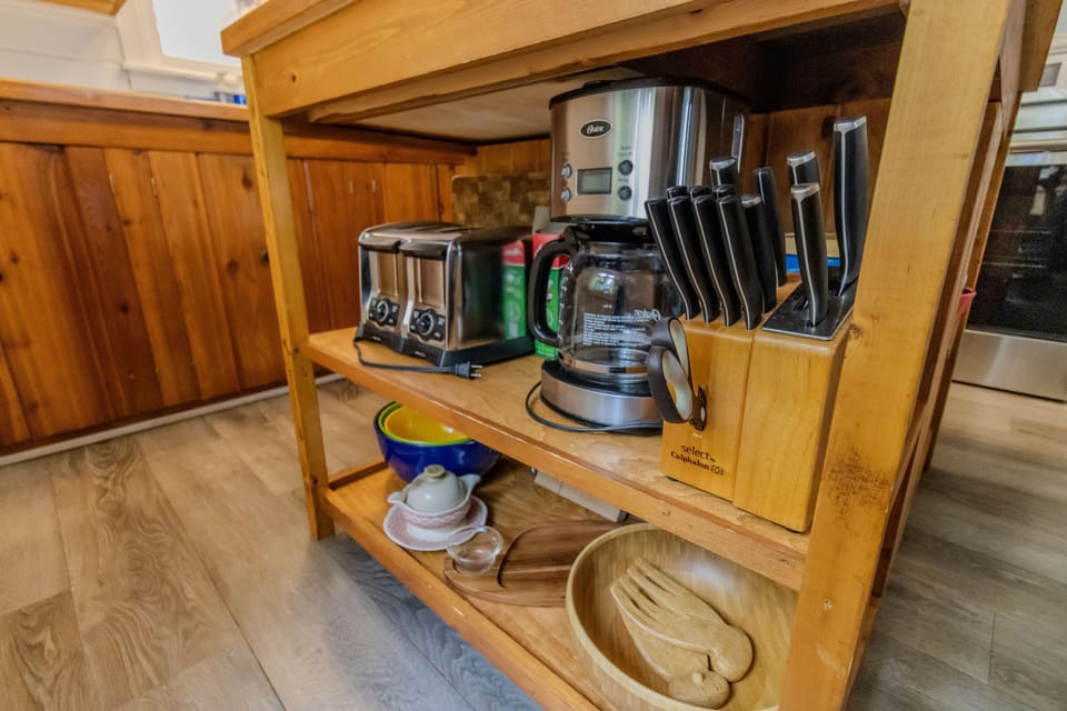 Kitchen Island - The kitchen island has the toaster, knives, and coffee maker.
