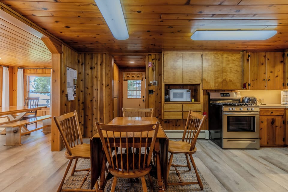 Additional Dining - An additional dining table in the kitchen area. The door to the side yard is visible.