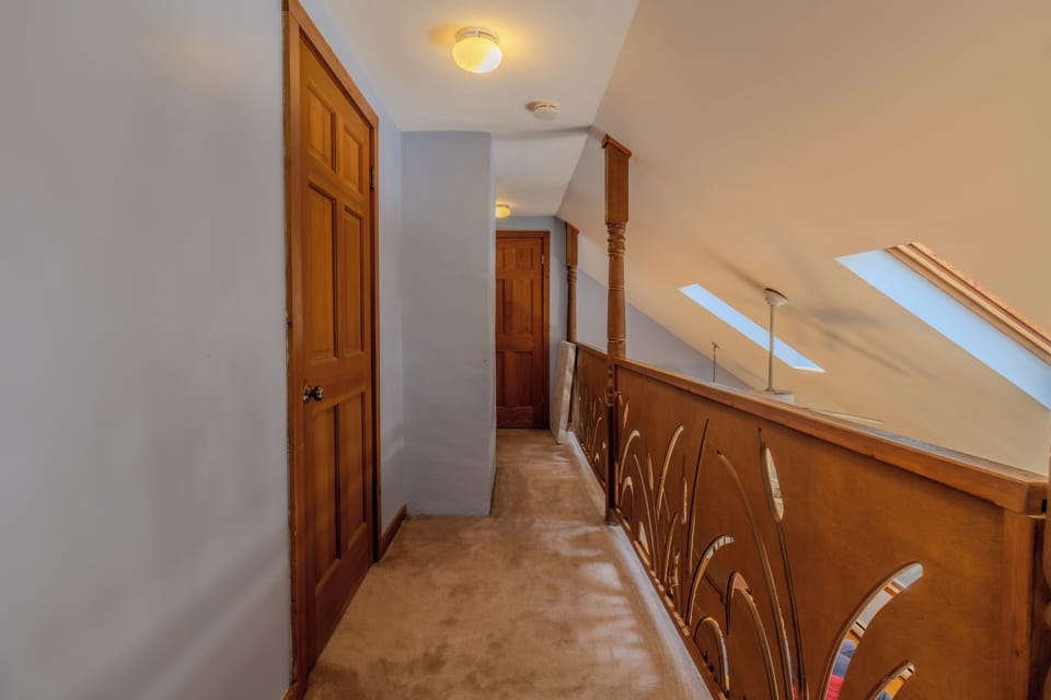 Hallway - Hallway leads to two bedrooms and a bathroom.