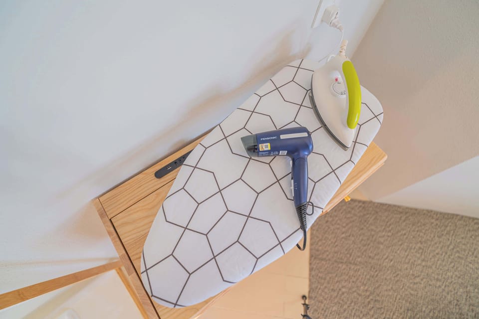 Iron, ironing board & the hair dryer.