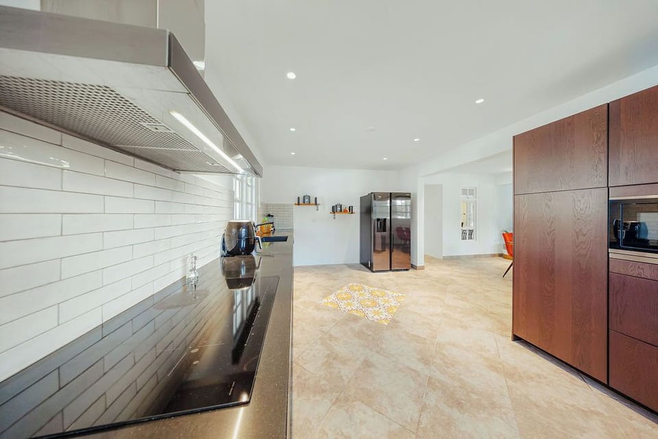 Fully equipped kitchen with ample counter space and essential appliances, ideal for preparing meals during your stay.