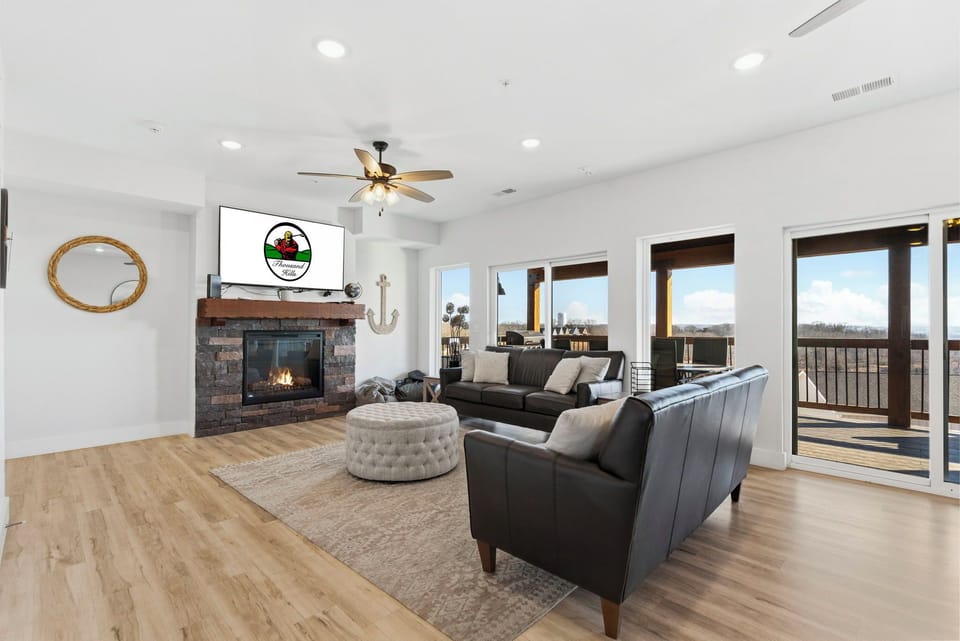 Living area with seasonal fireplace, streaming TV, comfortable seating, and a great lake view!