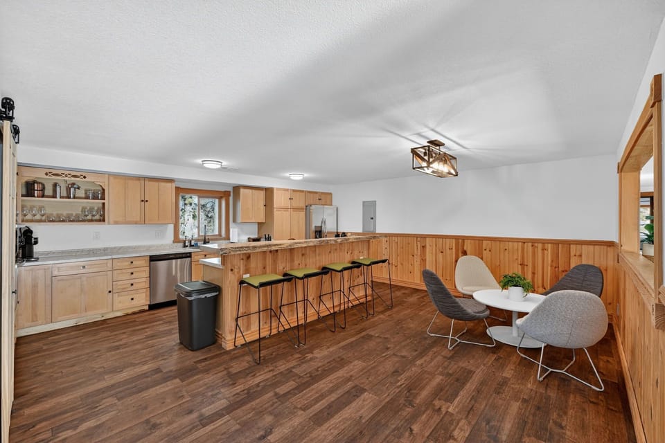 The kitchen has a window so it is open to the dining area- it also has a lounge seating and countertop stools. 