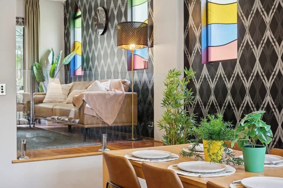 Where bold patterns meet cozy gatherings — a dining space made for long dinners and even longer conversations. 🍽️✨