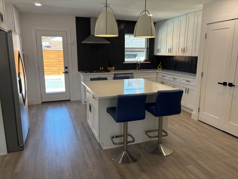 Rear door to fully fenced and locked rear yard with pool.  Alarm on door.