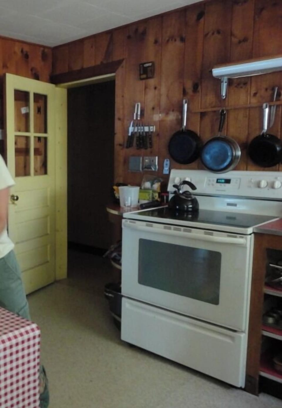 Your fully-equipped kitchen features rustic wood paneling and everything you need to prepare meals during your stay.