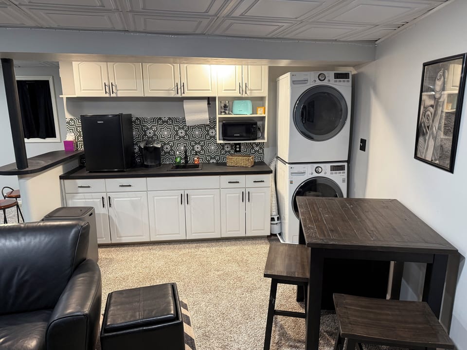 Kitchen dinette stocked refrigerator waters microwave toaster, Keurig provided