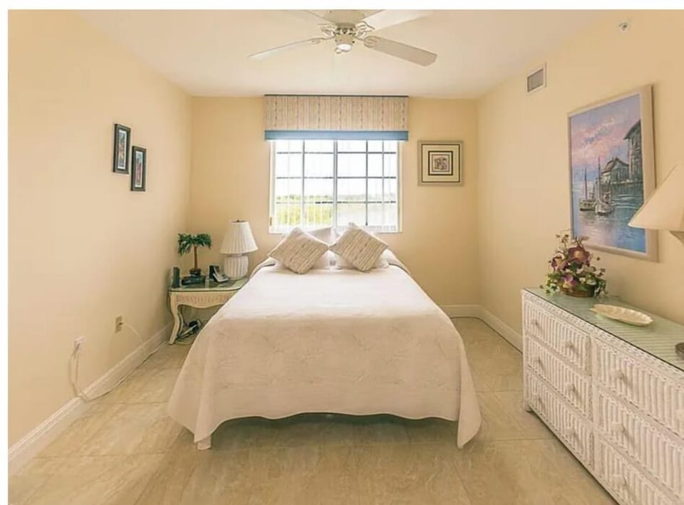 Wake up to soft morning light in your peaceful bedroom retreat. The crisp linens and coastal decor create a relaxing atmosphere perfect for unwinding after your day.