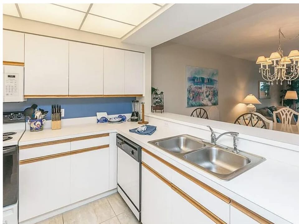 This bright, open kitchen gives you everything you need to prepare your favorite meals, with a skylight that fills the space with natural light and a seamless view into the dining area.