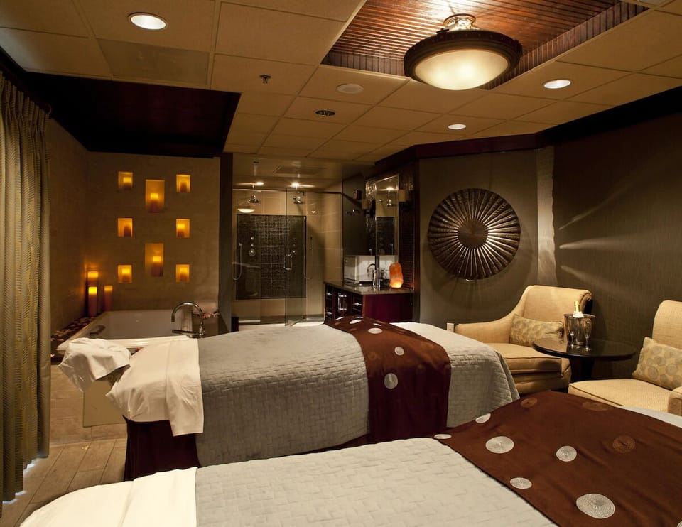 Unwind with soothing treatments in a warmly lit spa room.