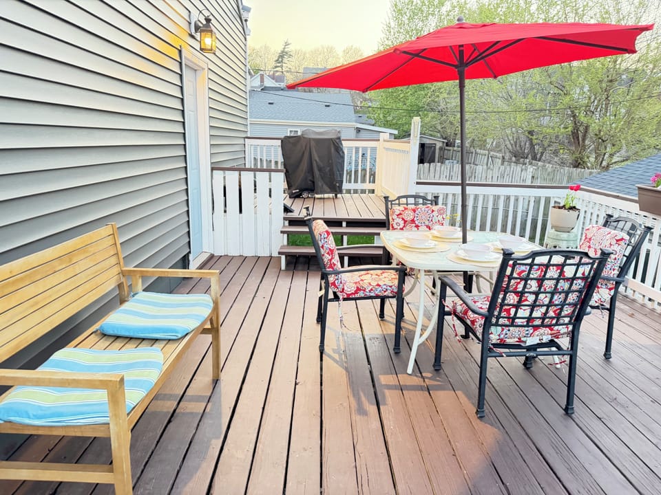 Large deck with plenty of room to gather, featuring a bench for extra seating.