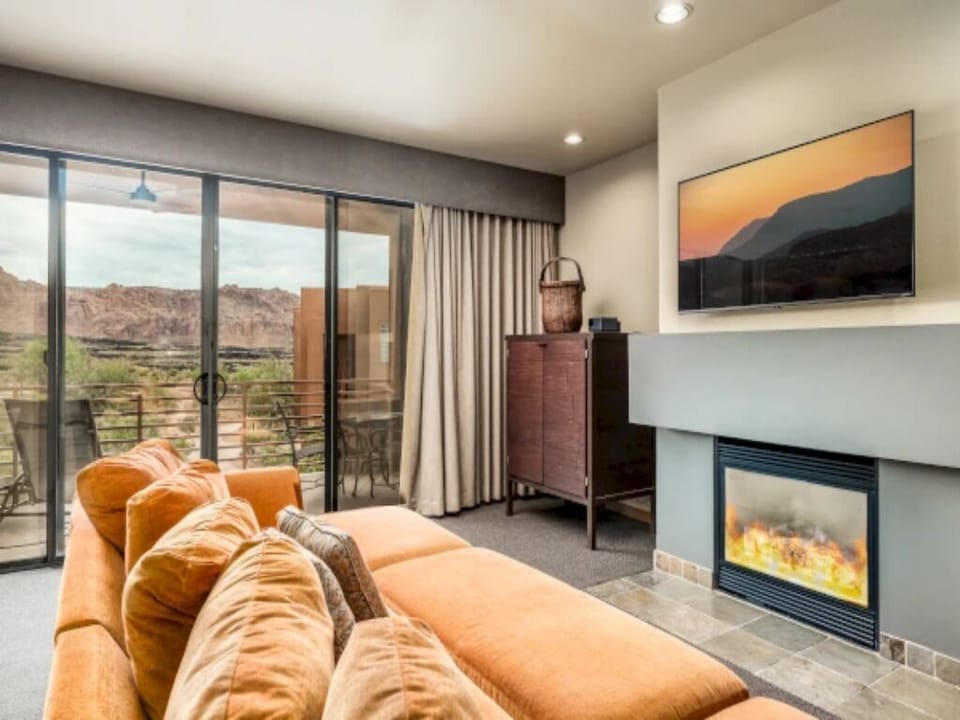Lounge on the sofa as the fire glows softly.