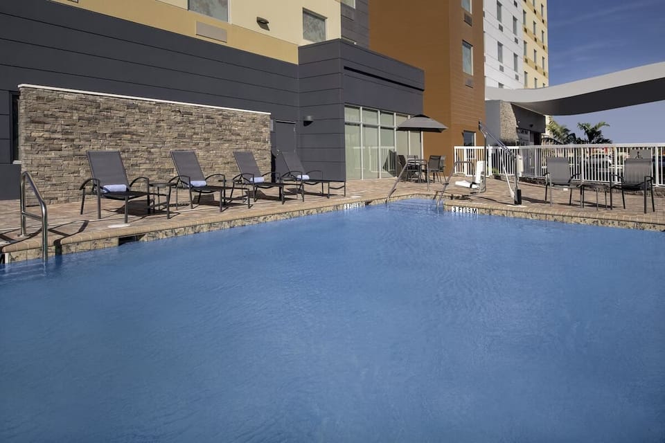 Soak up calm afternoons beside the sparkling outdoor pool.