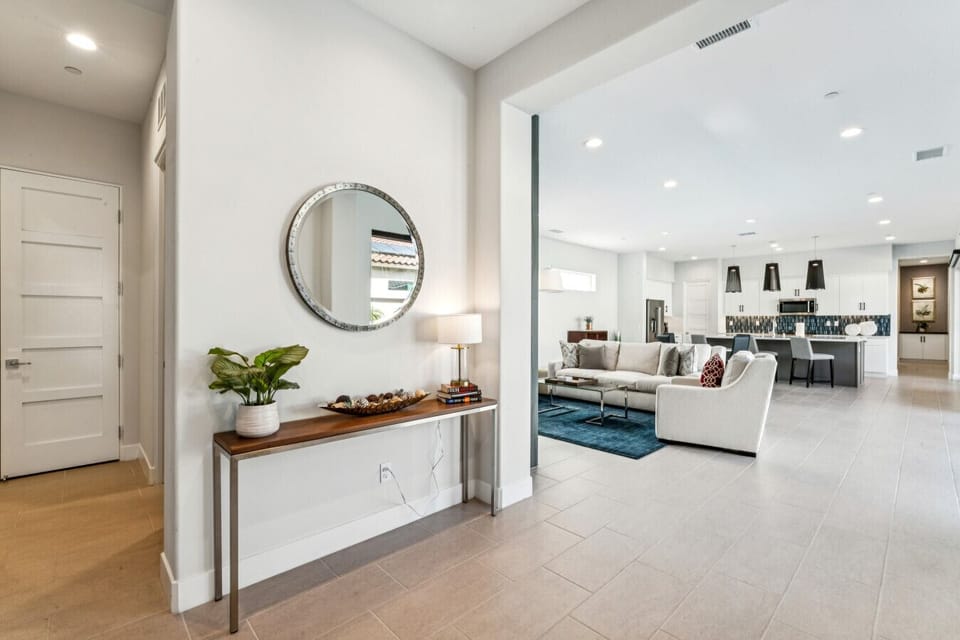 Bright entryway leading to the open-concept living space.