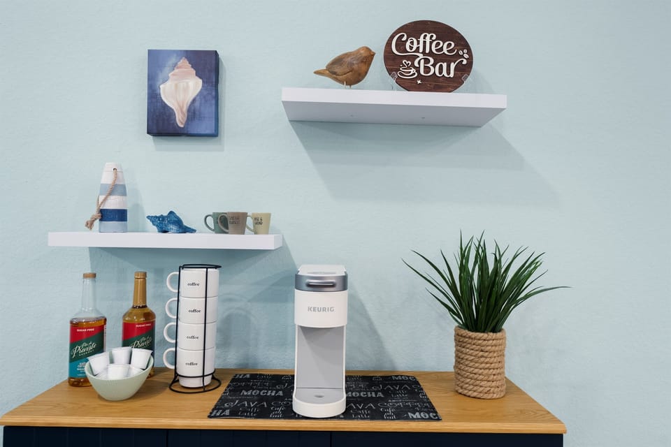 A thoughtfully styled beverage station offering a welcoming touch, ideal for morning coffee rituals or winding down with a drink in the evening.