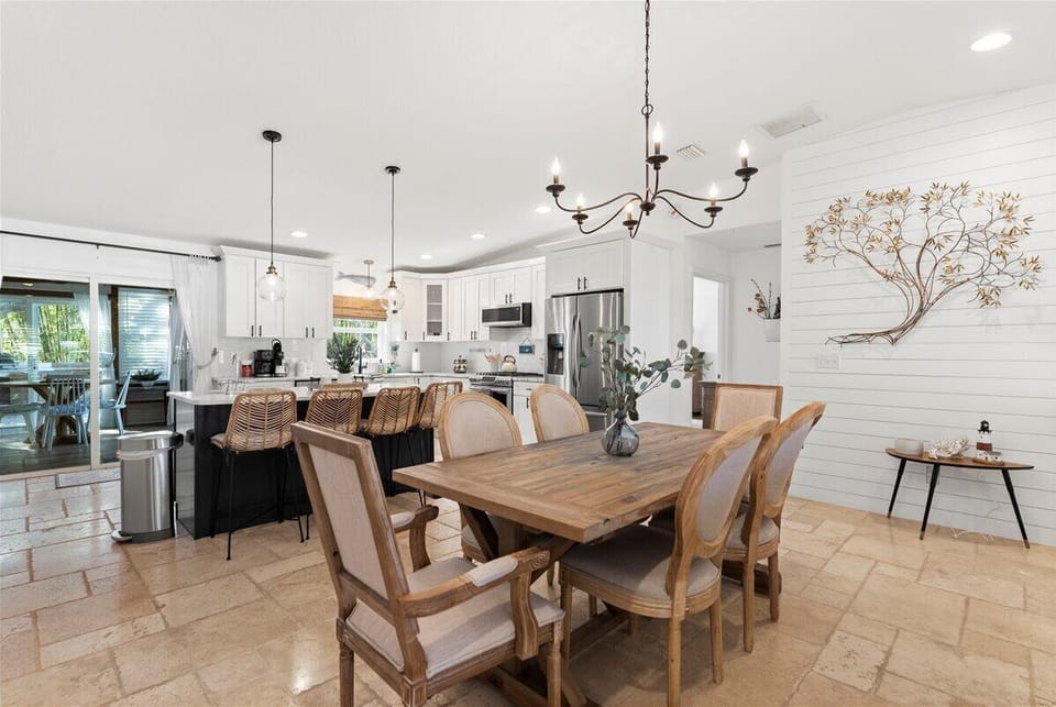 Dining Room: Savor meals in this elegant space with stylish lighting and natural views!


