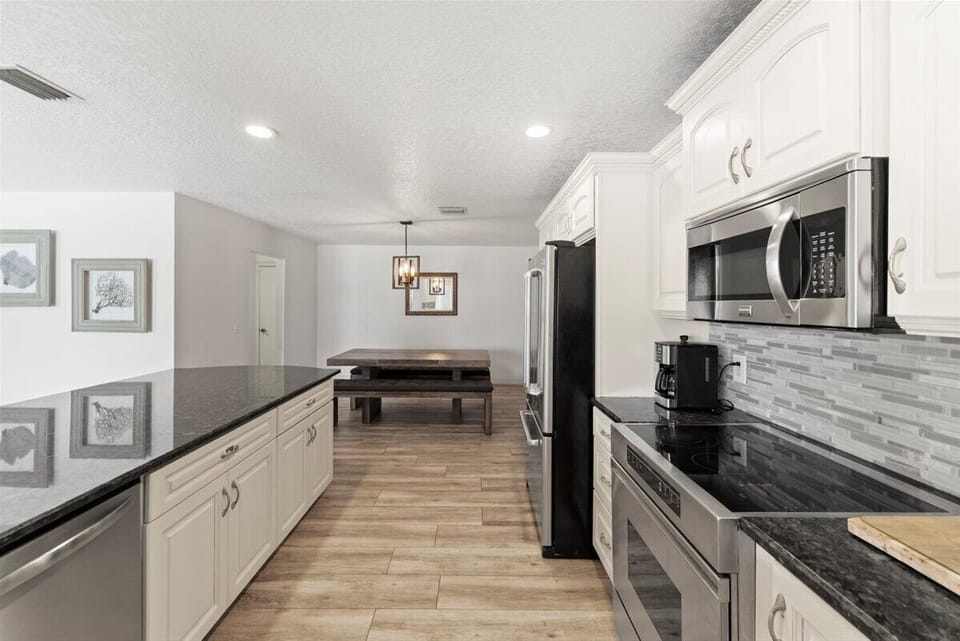 A thoughtfully designed kitchen with ample storage and prep space.