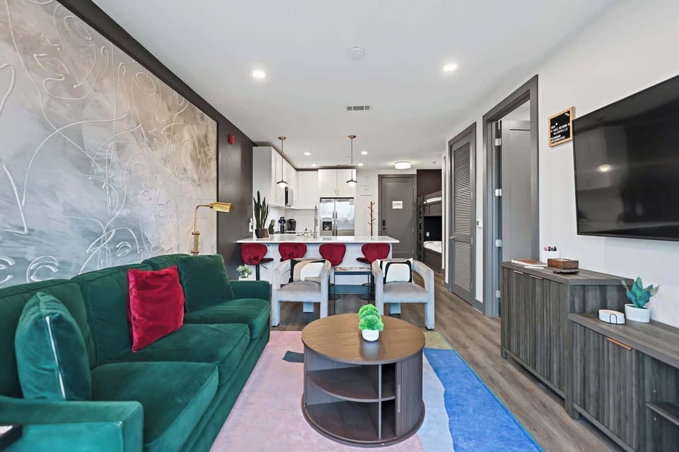Open living area with sofa sleeper and smart TV
