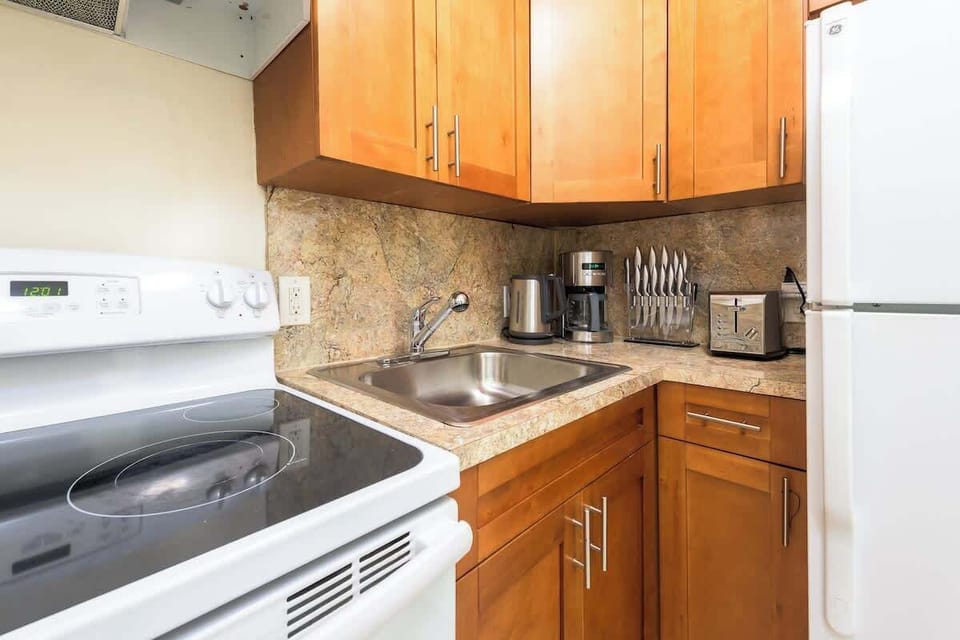 Compact and fully equipped—this cozy kitchen has everything you need for extended stays or quick meals.