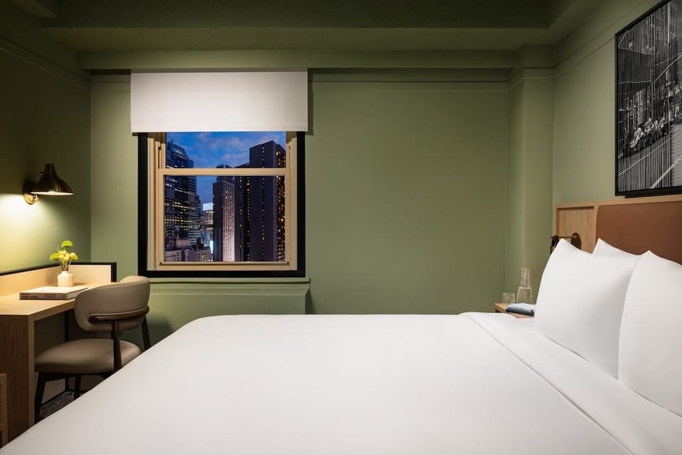 Wake up to skyline views beside crisp, cloud-soft bedding.