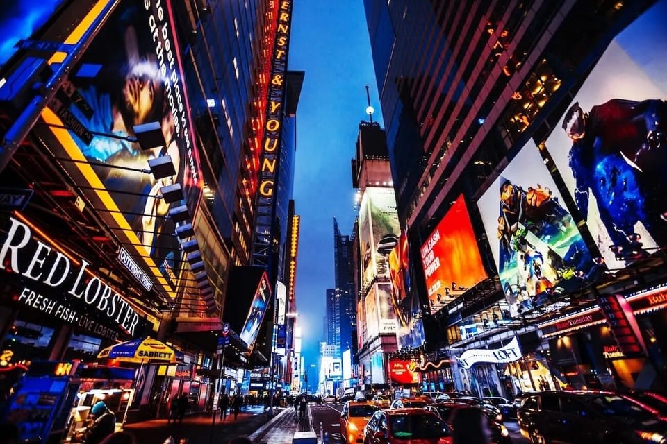 Step outside into neon-lit nightlife and iconic city buzz.