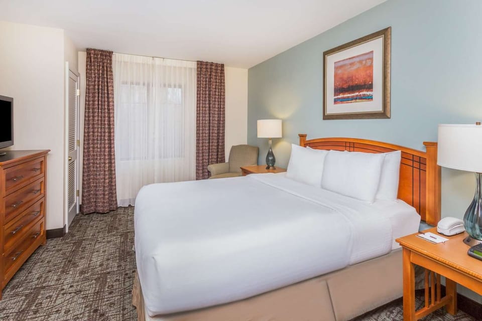 Unwind in crisp linens and soft lighting for deep sleep.