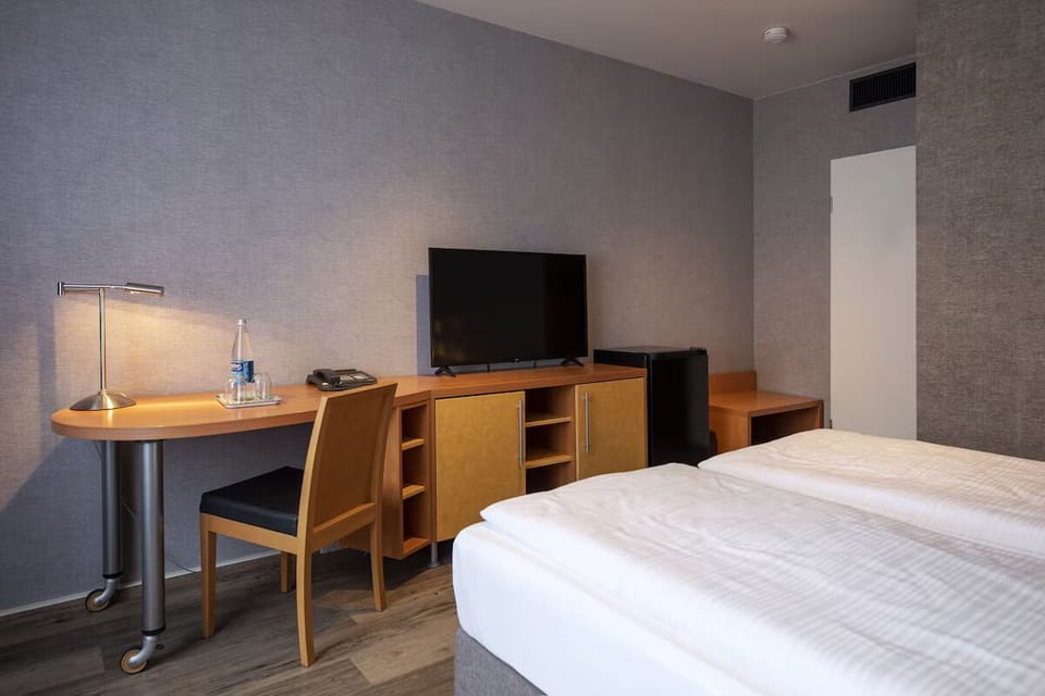 Settle in with a practical workspace and easy TV time.