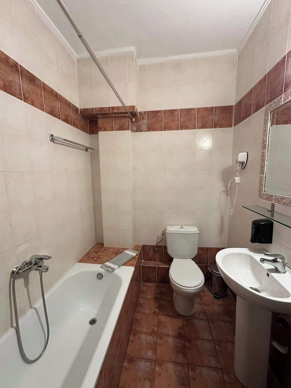 Clean and Spacious Bathroom with Bathtub and Vanity