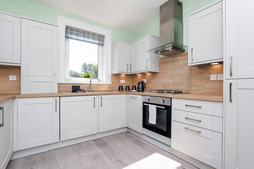 This bright kitchen offers convenience and functionality.