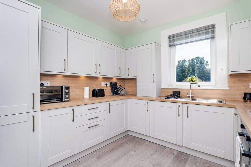 A clean and fully equipped kitchen ready for your culinary needs.